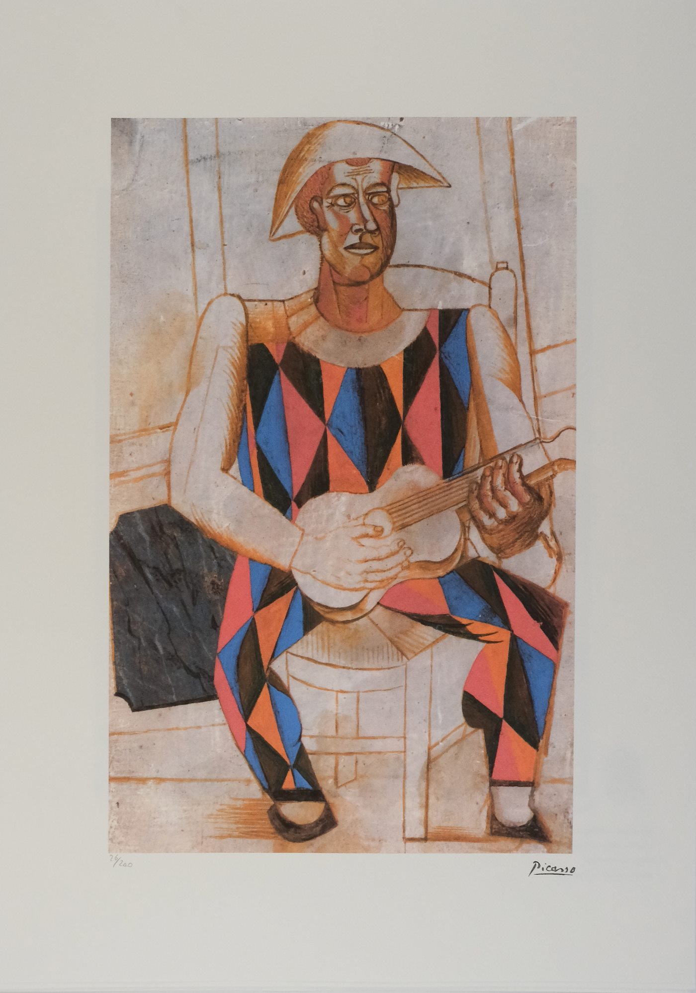 Pablo Picasso - Harlekýn s kytarou
