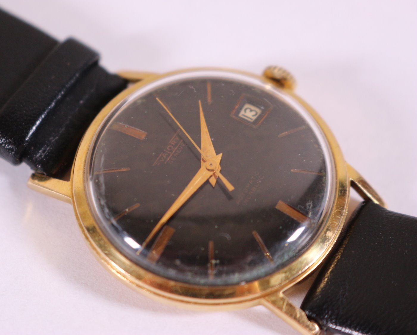 Zlaté pánské náramkové hodinky Walory Swiss - Pánské zlaté náramkové hodinky, zlato, punc LYRA, 750/1000, hrubá hmotnost 31,65g. Přiloženo osvědčení PÚ.
