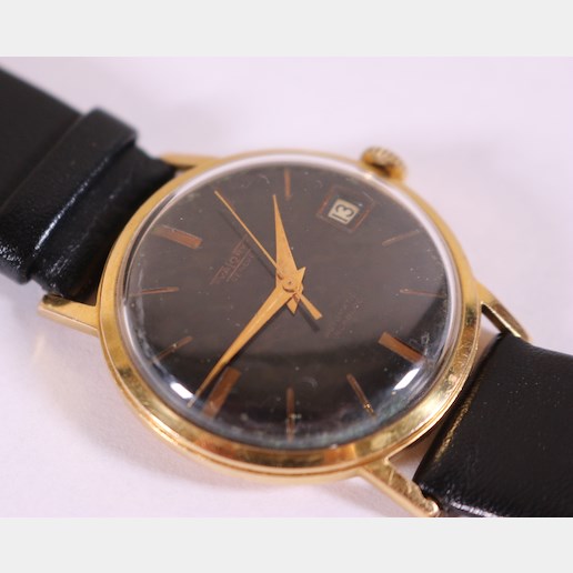 Zlaté pánské náramkové hodinky Walory Swiss - Pánské zlaté náramkové hodinky, zlato, punc LYRA, 750/1000, hrubá hmotnost 31,65g. Přiloženo osvědčení PÚ.